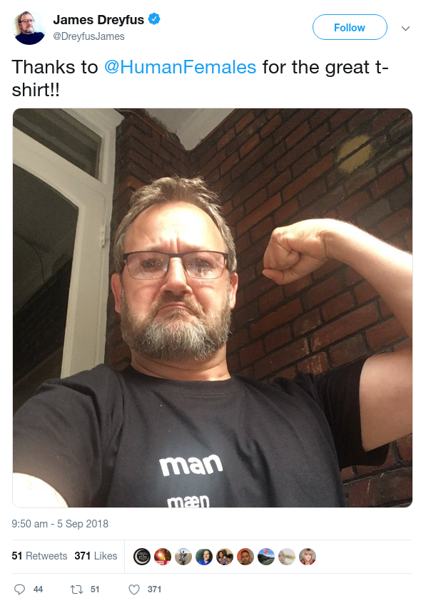 Twitter screenshot of British comedy actor James Dreyfus wearing an 'adult human male' shirt while flexing. 'Thanks to @HumanFemales for the great t-shirt!!'